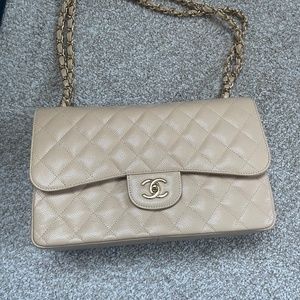 Chanel beige Clair jumbo double flap bag.